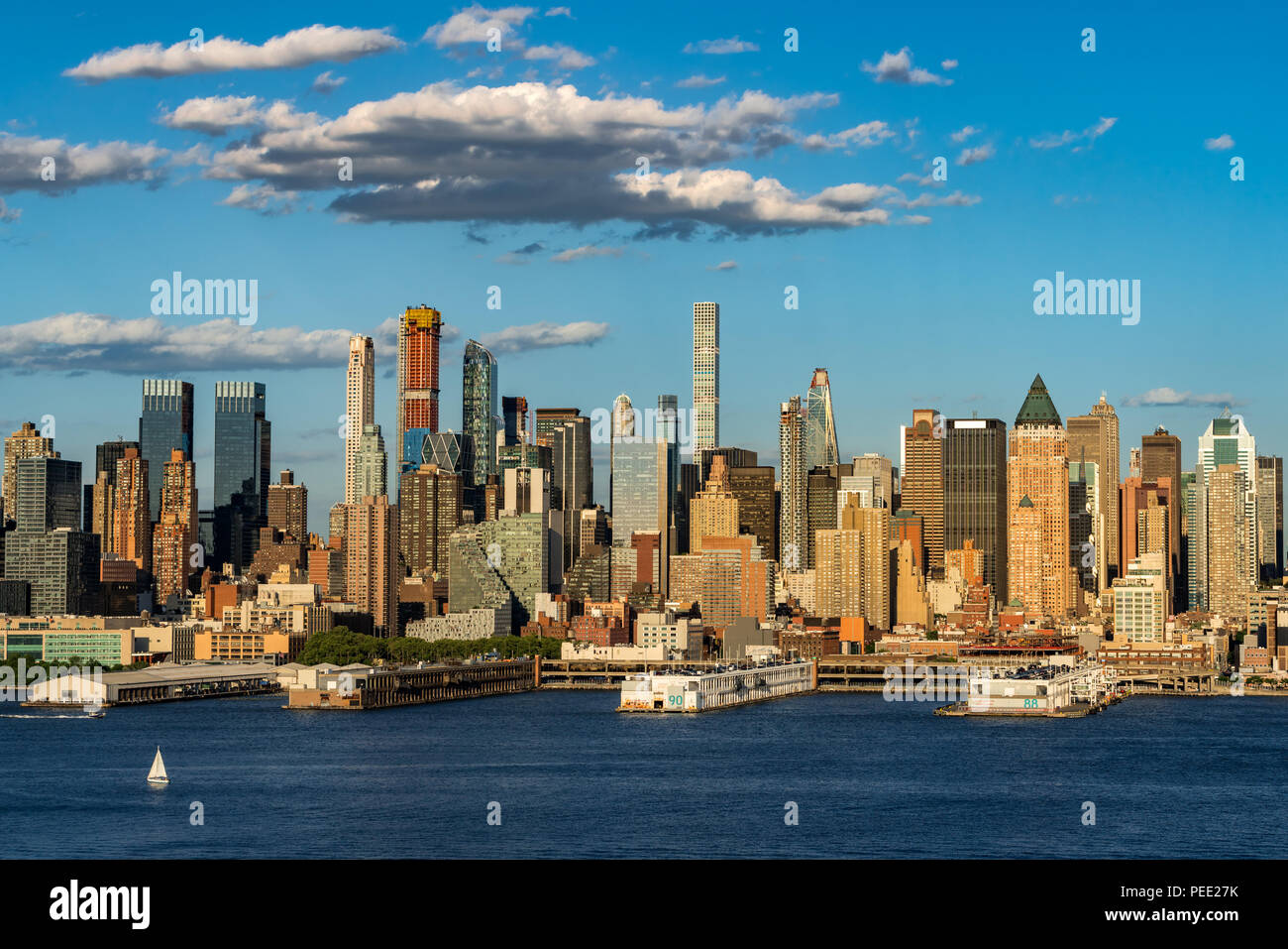 The skyscrapers of Manhattan Midtown West with the Hudson River in afternoon light. New York City Stock Photo