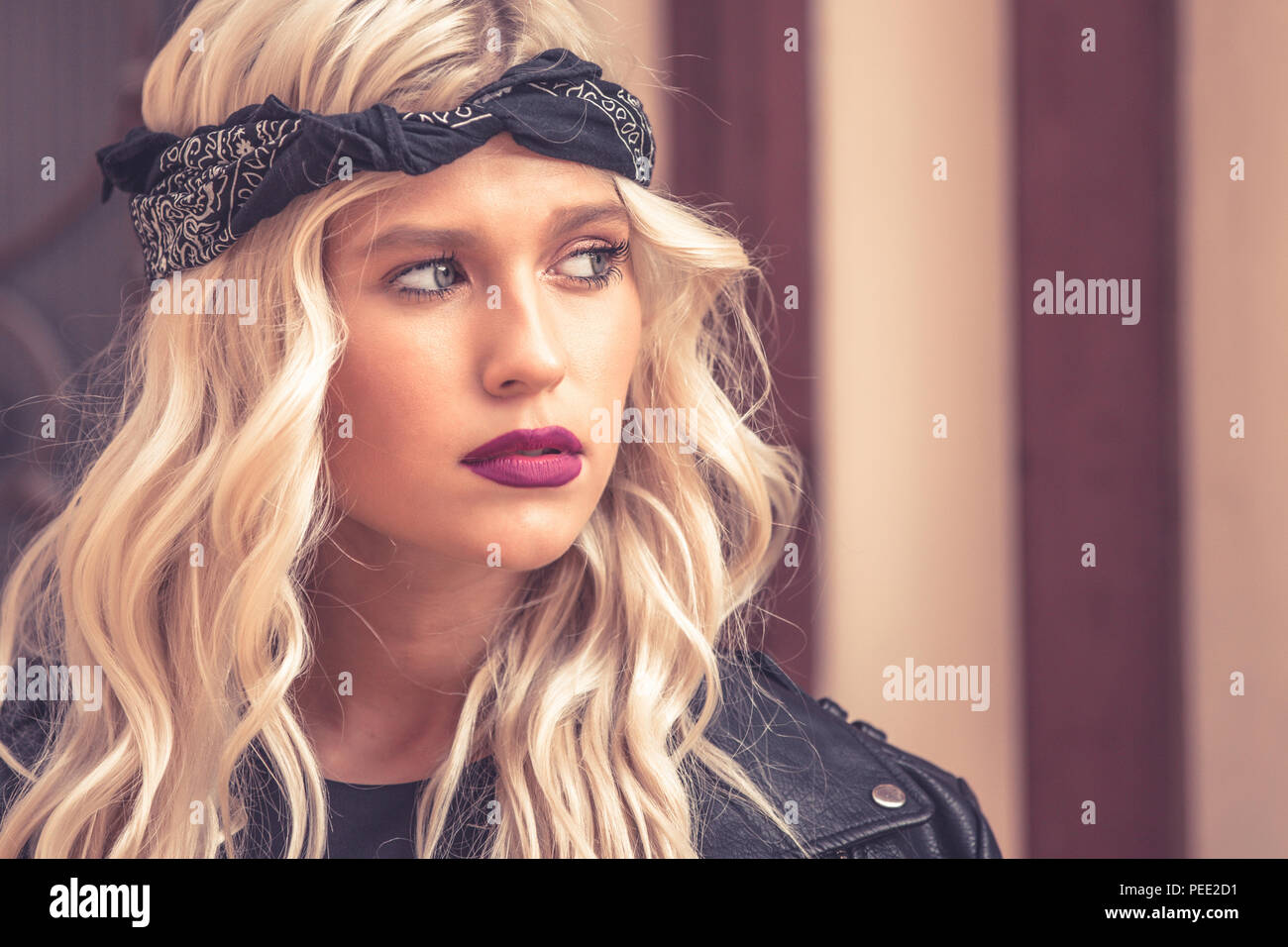 Close up potrait of attractive young woman with beautiful blonde curly ...