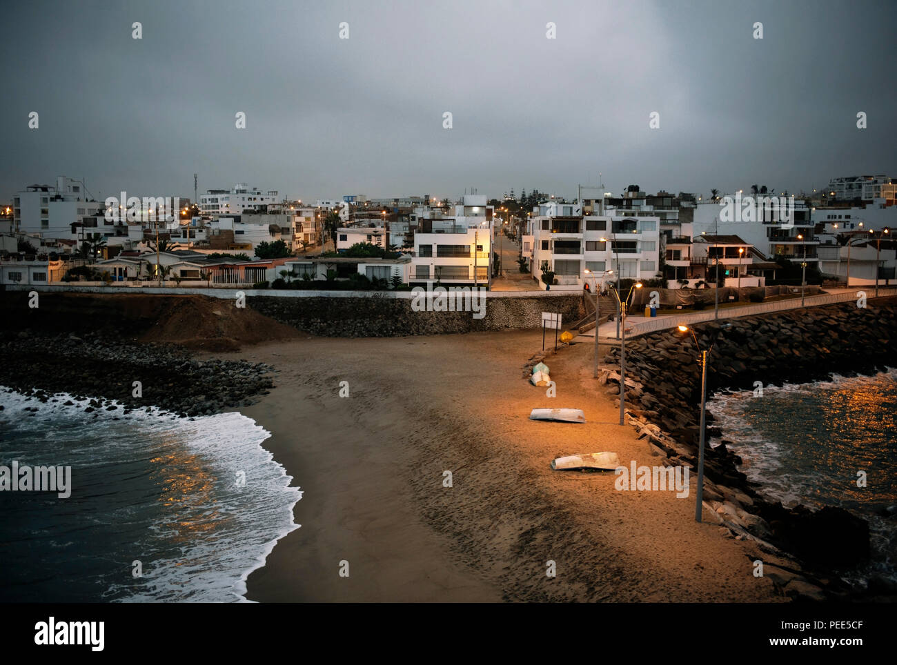 Houses on 'Malecon Norte' in Punta Hermosa beach town (captured from 'La Isla', a rocky island joined to the land) in Lima Province, Peru. Jul 2018 Stock Photo