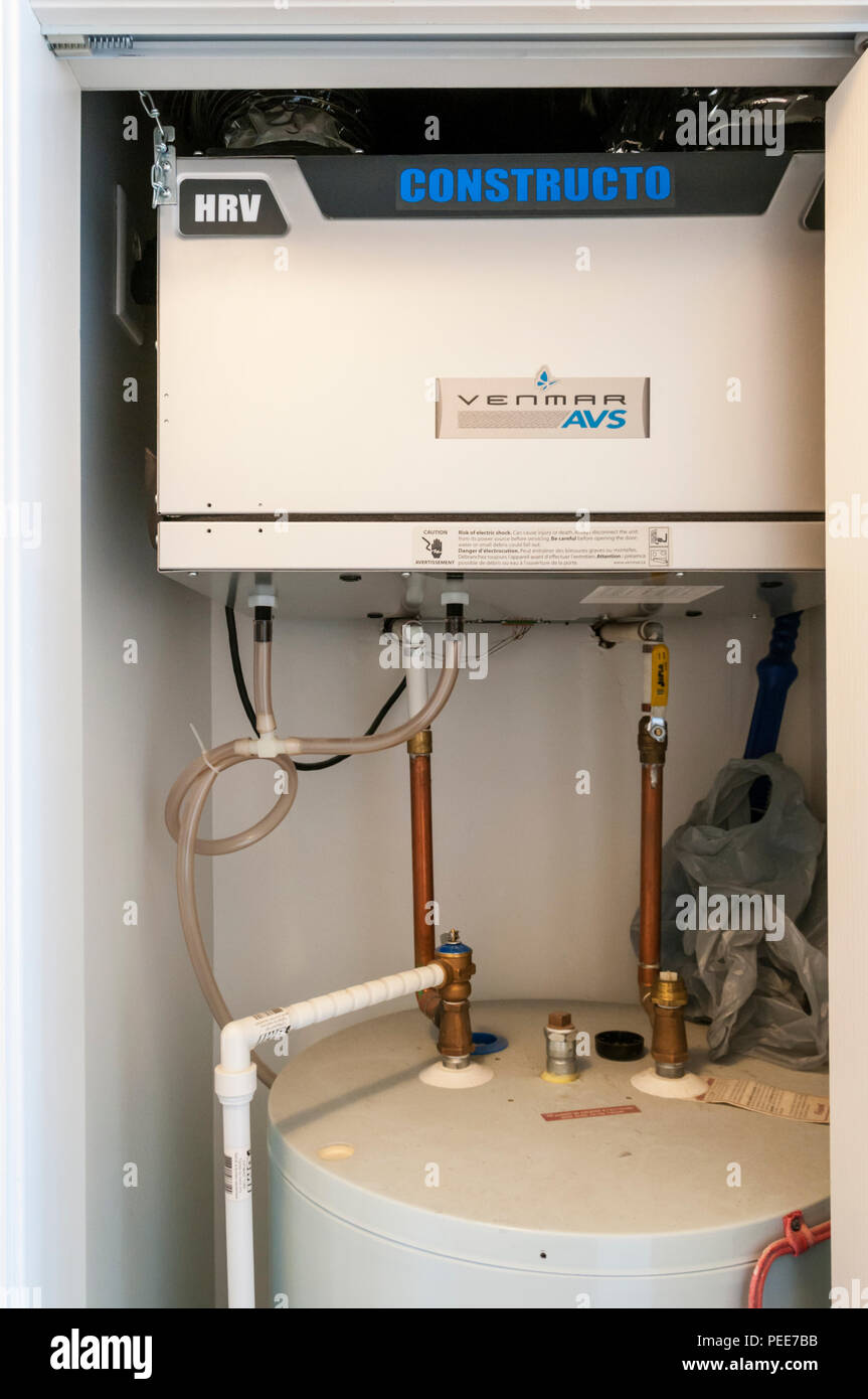 Constructo Venmar AVS Heat Recovery Ventilator unit installed in a domestic property. Stock Photo