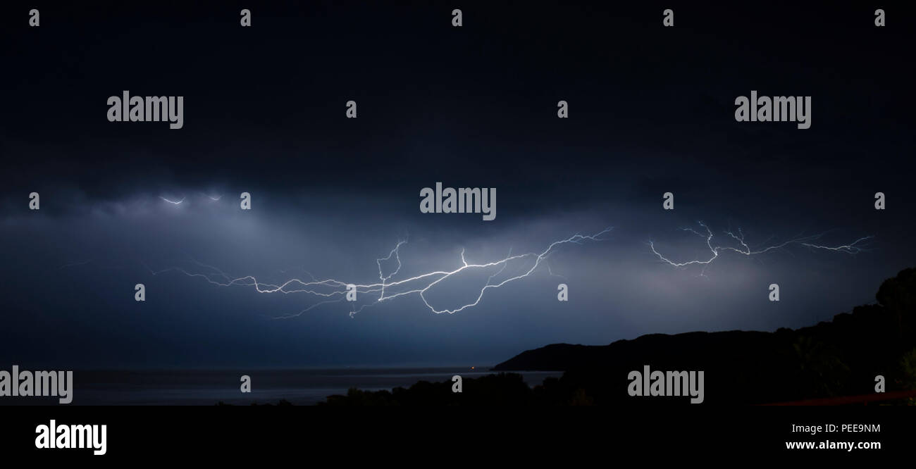 stormy night on the sea with lightning Stock Photo - Alamy