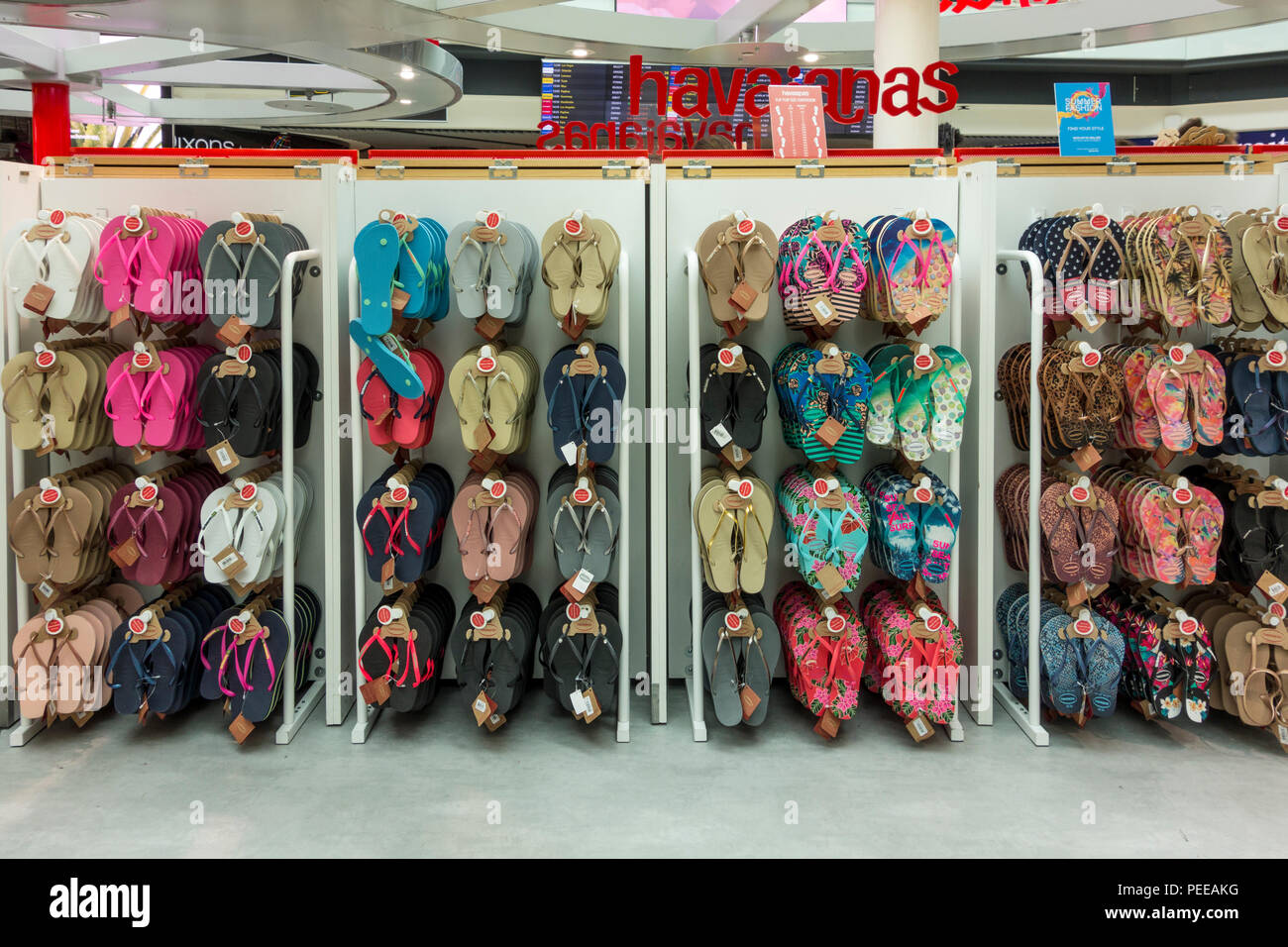Display of flip flops in a  Duty Free shop at Gatwick Airport, Crawley, West Sussex, UK Stock Photo