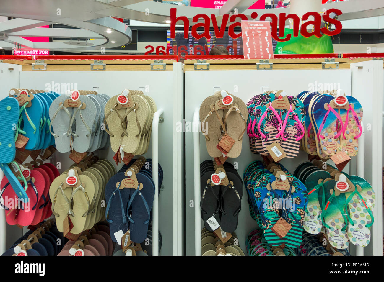 Display of flip flops in a  Duty Free shop at Gatwick Airport, Crawley, West Sussex, UK Stock Photo