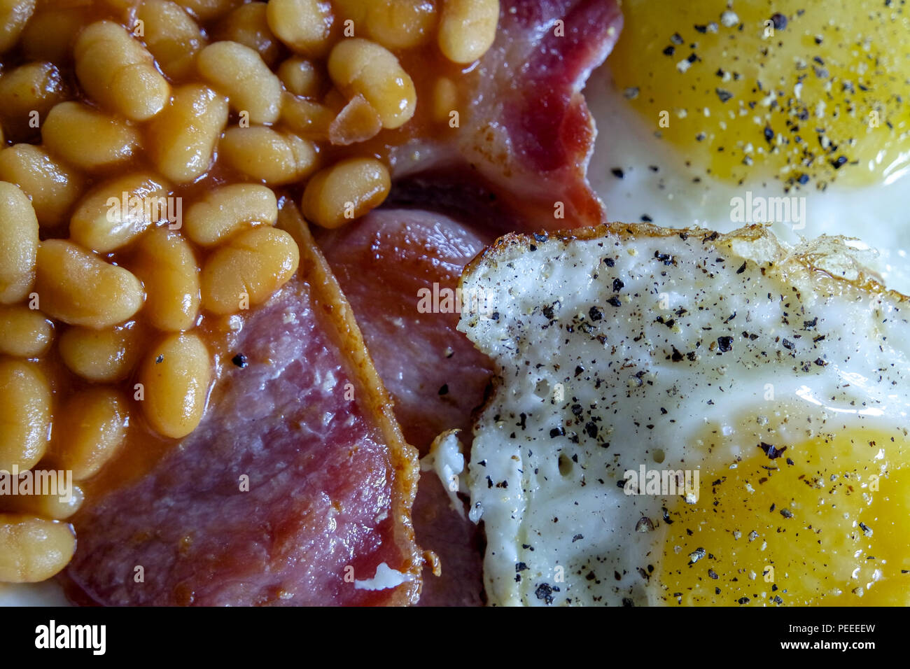 Cooked breakfast. Bacon, Eggs, Beans, Toast Stock Photo - Alamy