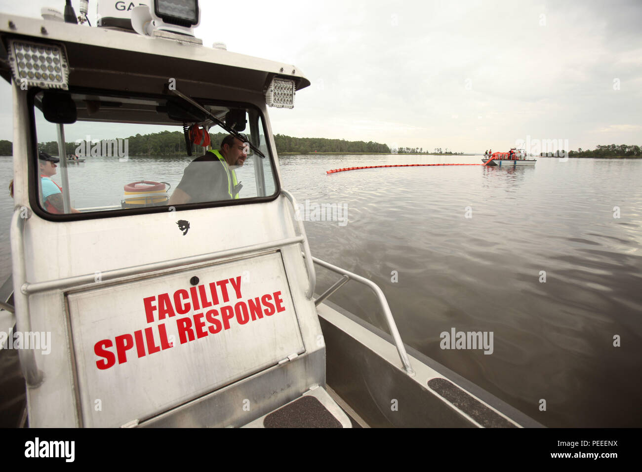 Timothy Lawrence steers a response boat during a facility response 