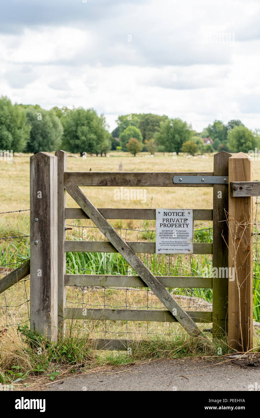 Private property notice on wooden gate at an entrance to Harnham water meadows Stock Photo