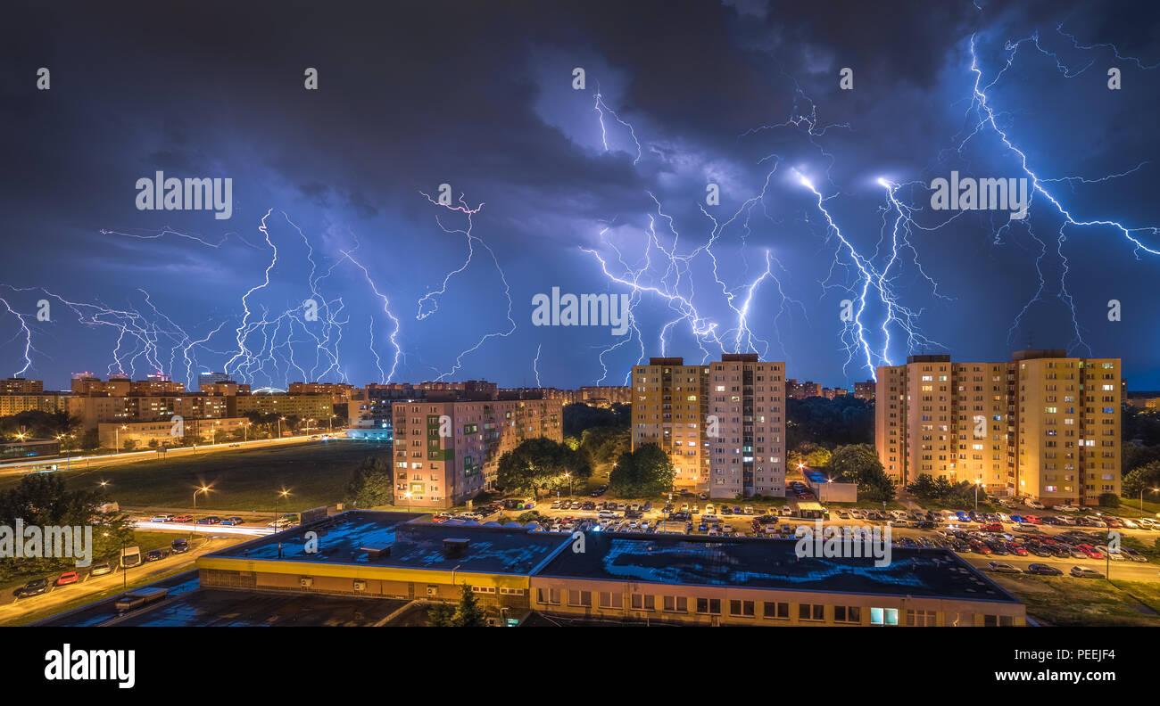 Many Lightnings Over Housing Estate. Night Storm in the City. Stock Photo
