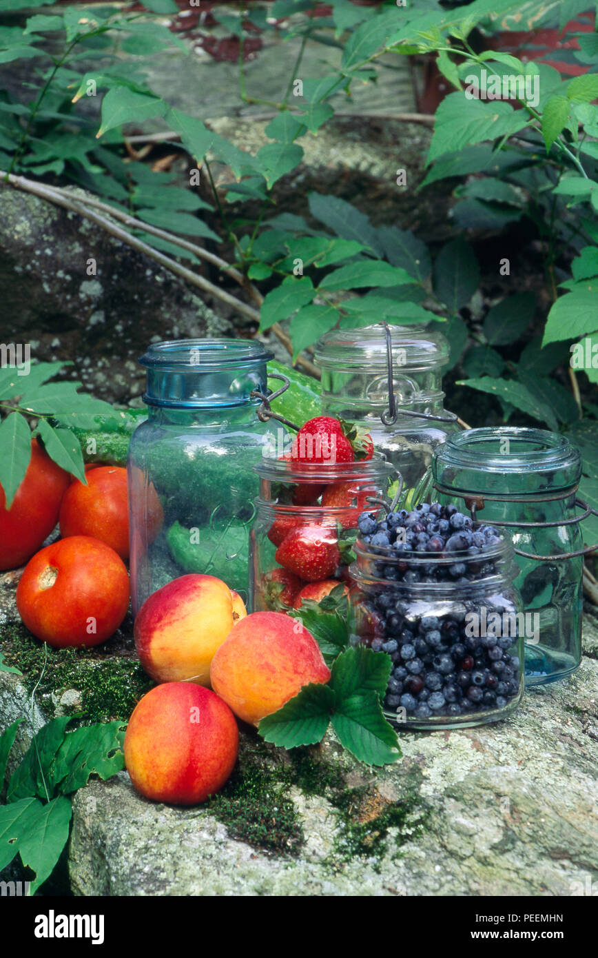 Fresh fruit, berries and tomatoes with oldfashioned home preserving