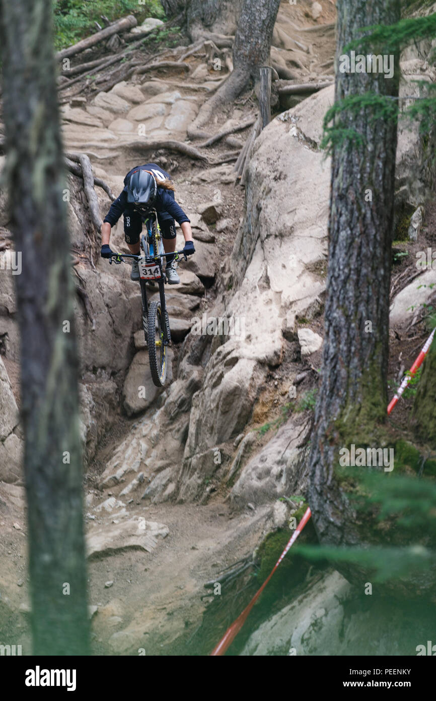 Morgane Charre (FRA) navigates the In Deep trail while racing to  fifth place in the the Crankworx Garbanzo DH event, Whistler, BC, Canada. August 14, Stock Photo