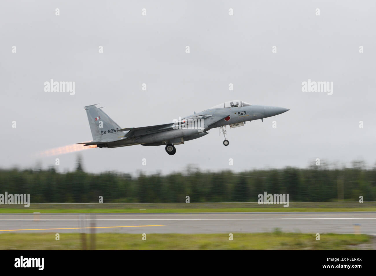 A Japanese Air Self-Defense Force F-15J Eagle takes off from Eielson Air Force Base, Alaska, Aug. 10, 2015, during Red Flag-Alaska (RF-A) 15-3. RF-A is a series of Pacific Air Forces commander-directed field training exercises for U.S. and partner nation forces, providing combined offensive counter-air, interdiction, close air support and large force employment training in a simulated combat environment. (U.S. Air Force photo by Senior Airman Ashley Nicole Taylor/Released) Stock Photo