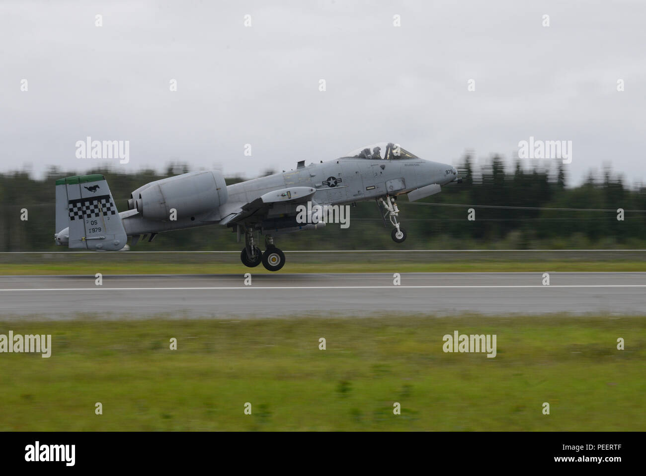 A U.S. Air Force A-10 Thunderbolt II assigned to the 25th Fighter Squadron, Osan Air Base, Republic of Korea, takes off from Eielson Air Force Base, Alaska, Aug. 10, 2015, during Red Flag-Alaska (RF-A) 15-3. RF-A is a series of Pacific Air Forces commander-directed field training exercises for U.S. and partner nation forces, providing combined offensive counter-air, interdiction, close air support and large force employment training in a simulated combat environment. (U.S. Air Force photo by Senior Airman Ashley Nicole Taylor/Released) Stock Photo