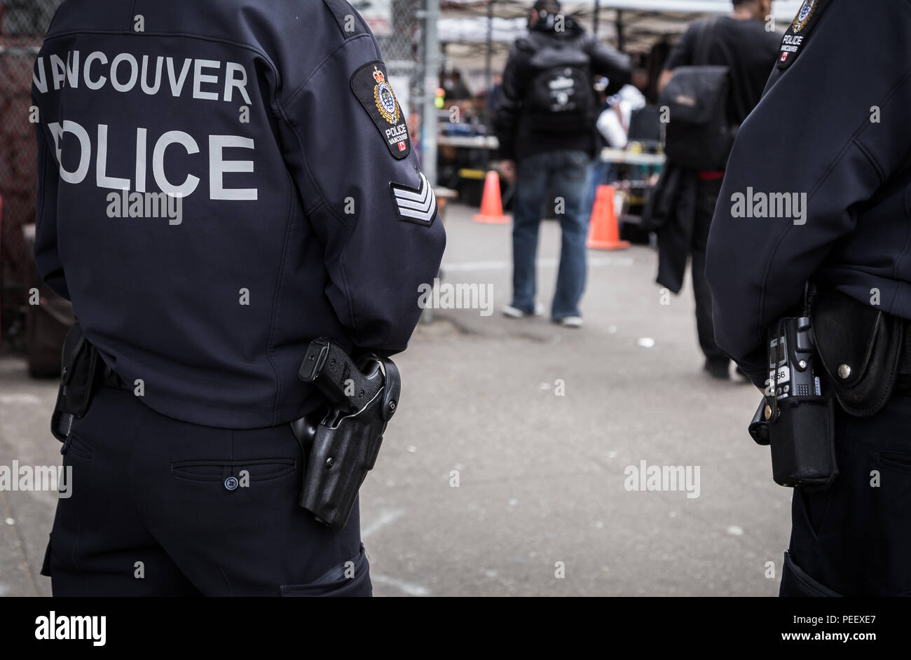 VANCOUVER, BC, CANADA - MAY 11, 2016: A close-up of a Vancouver Police Officer's gun and crest as they patrol the Downtown Eastside. Stock Photo