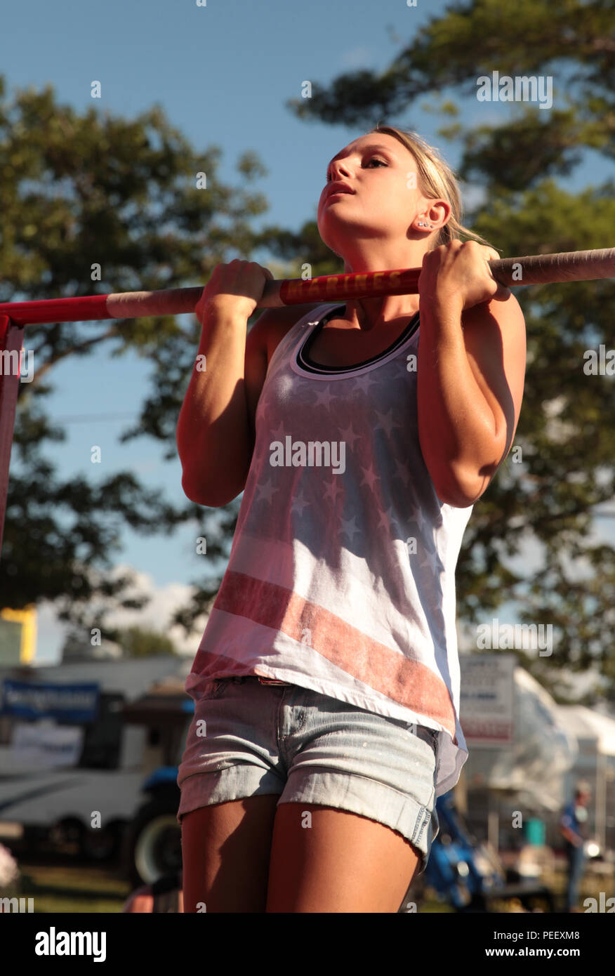A participant does a flexed arm hang as part at the Marine Corps