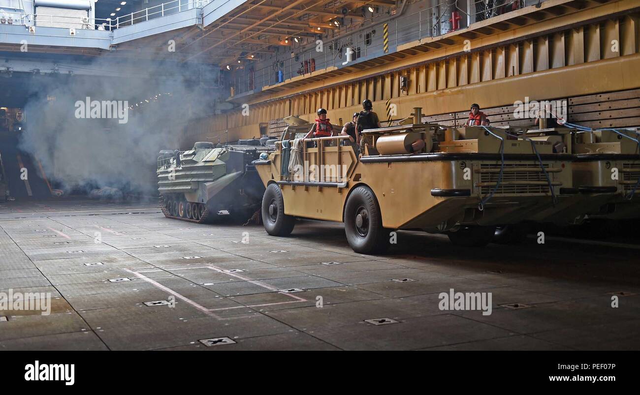 150813-N-KM939-171SAIPAN HARBOR, Saipan (Aug. 13, 2015) - Sailors from Navy Beach Party Team, attached to Naval Beach Unit (NBU) 7 and embarked on the amphibious dock landing ship USS Ashland (LSD 48), prepare to launch the Lighter Amphibious Resupply Cargo Vehicle (LARC-V) out of the well deck during disaster relief efforts after Typhoon Soudelor. Ashland is on patrol in the U.S. 7th Fleet area of operations. (U.S. Navy photo by Mass Communication Specialist 3rd Class David A. Cox/Released) Stock Photo