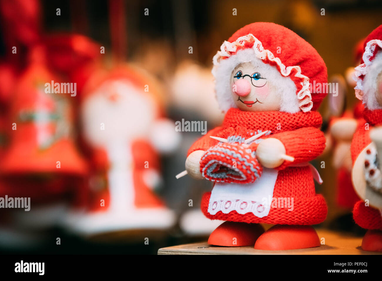 Tallinn, Estonia - December 2, 2016: Traditional Souvenirs Grandmother Wooden Doll Toy At European Winter Christmas Market. New Year Wooden Souvenir F Stock Photo