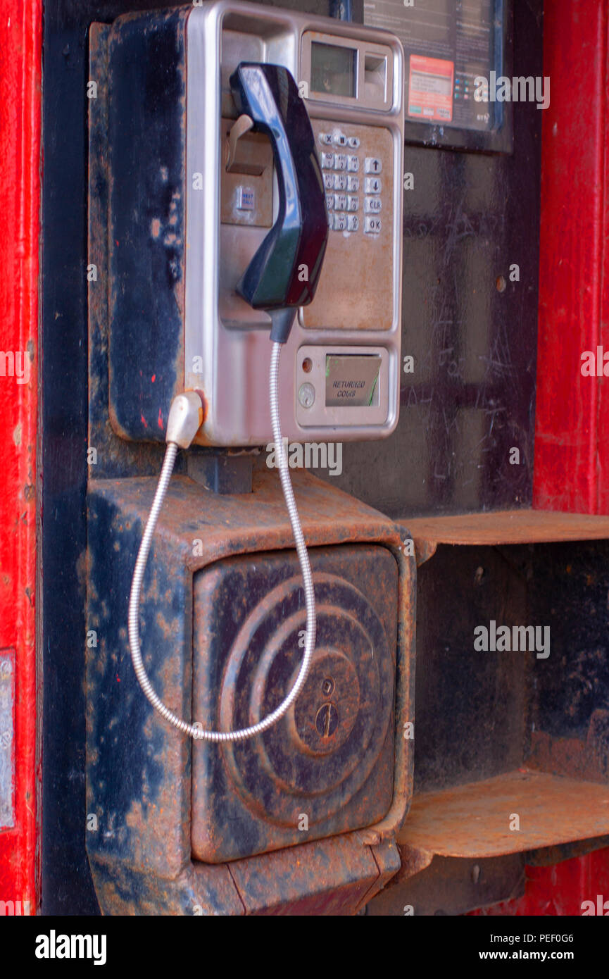 Interior of an old red British public telephone box Stock Photo