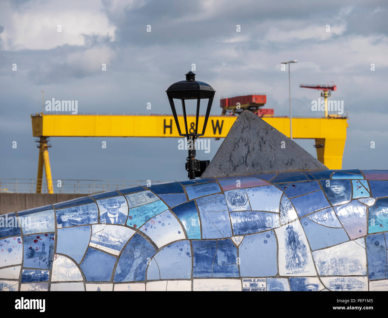 Belfast, Northern Ireland, UK -  August, 8, 2018: The Big Fish or Salmon of Knowledge with one of the Harland and Wolff shipyard cranes in the backgro Stock Photo