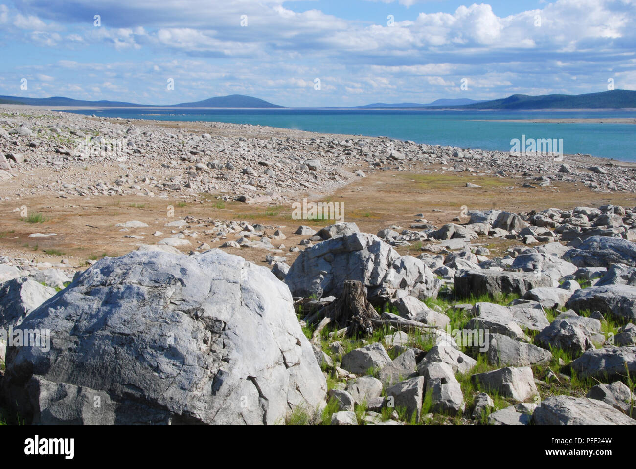 Rocky shore of (dammed) lake Tjaktjajaure. Jokkmokk, Norbotten, Sweden. 28.6.2009 Stock Photo