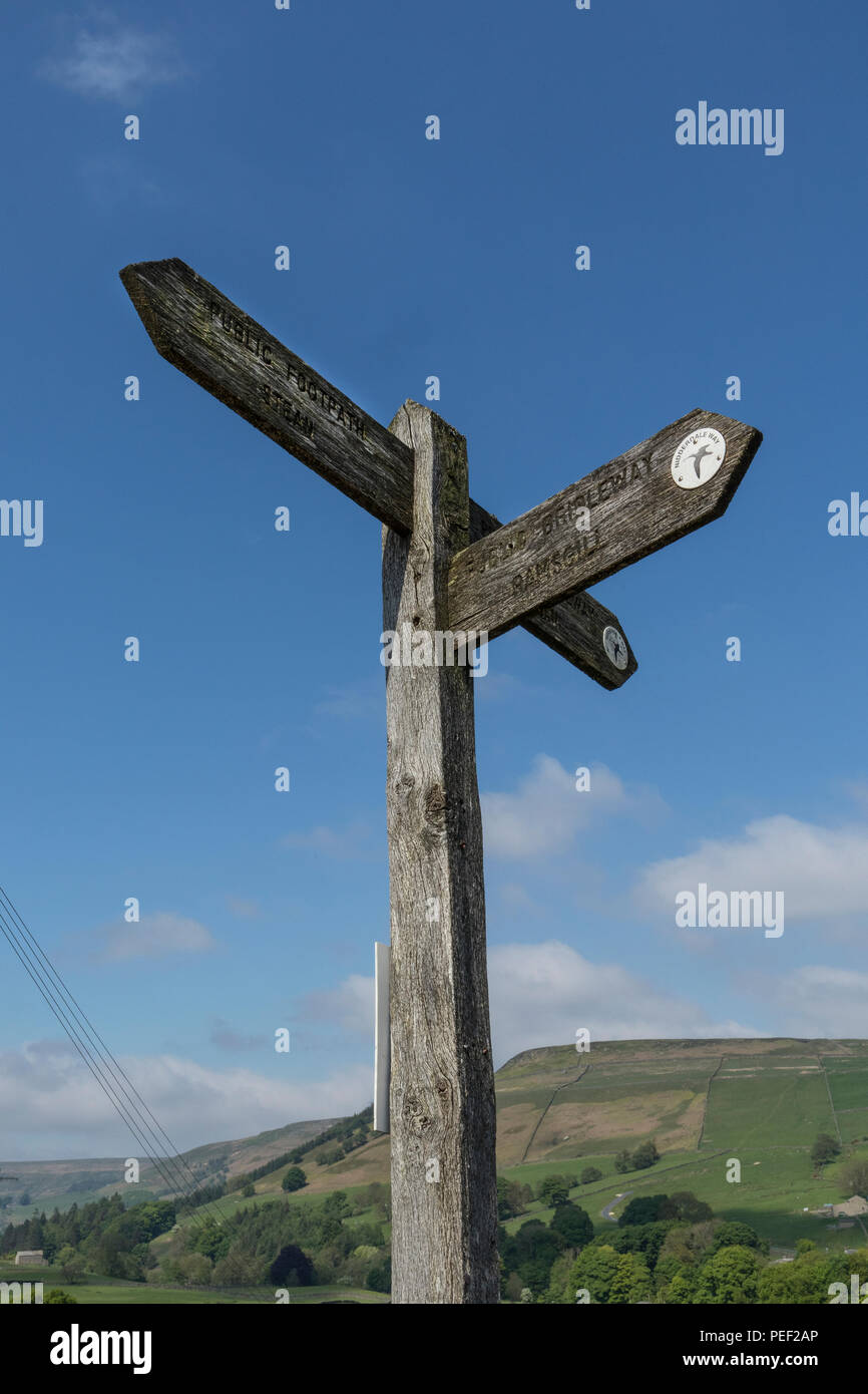 Old wooden signpost for the Nidderdale Way, in Nidderdale, North Yorkshire, England, UK Stock Photo