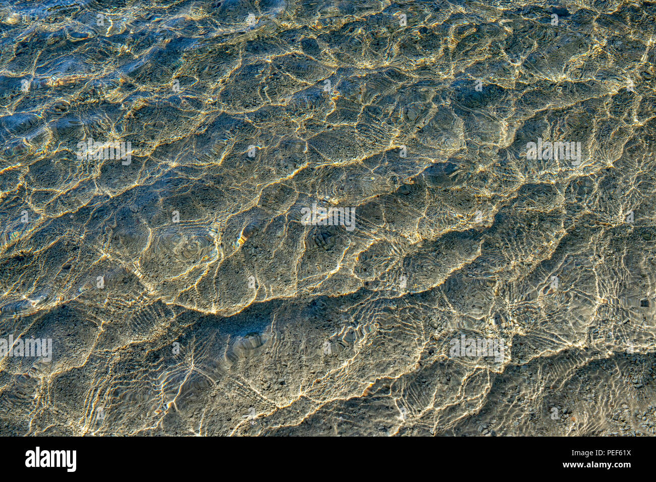 Water surface with light reflections, Hohe Tauern National Park, East Tyrol, Austria Stock Photo