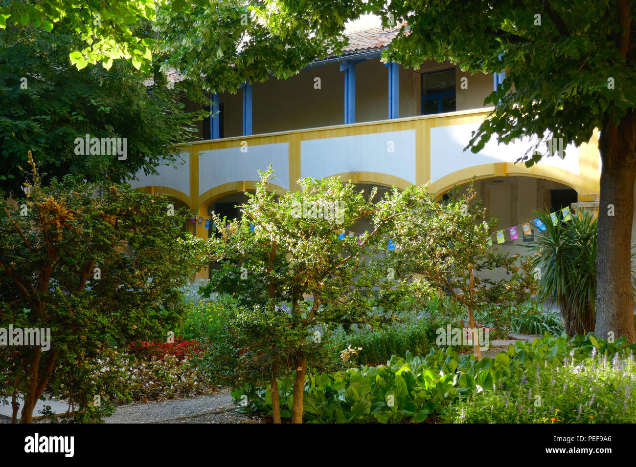 Hotel Dieu gardens, Arles, France. Vincent van Gogh stayed here at the Old Hospital to recuperate after cutting off his ear. He painted these gardens . Stock Photo