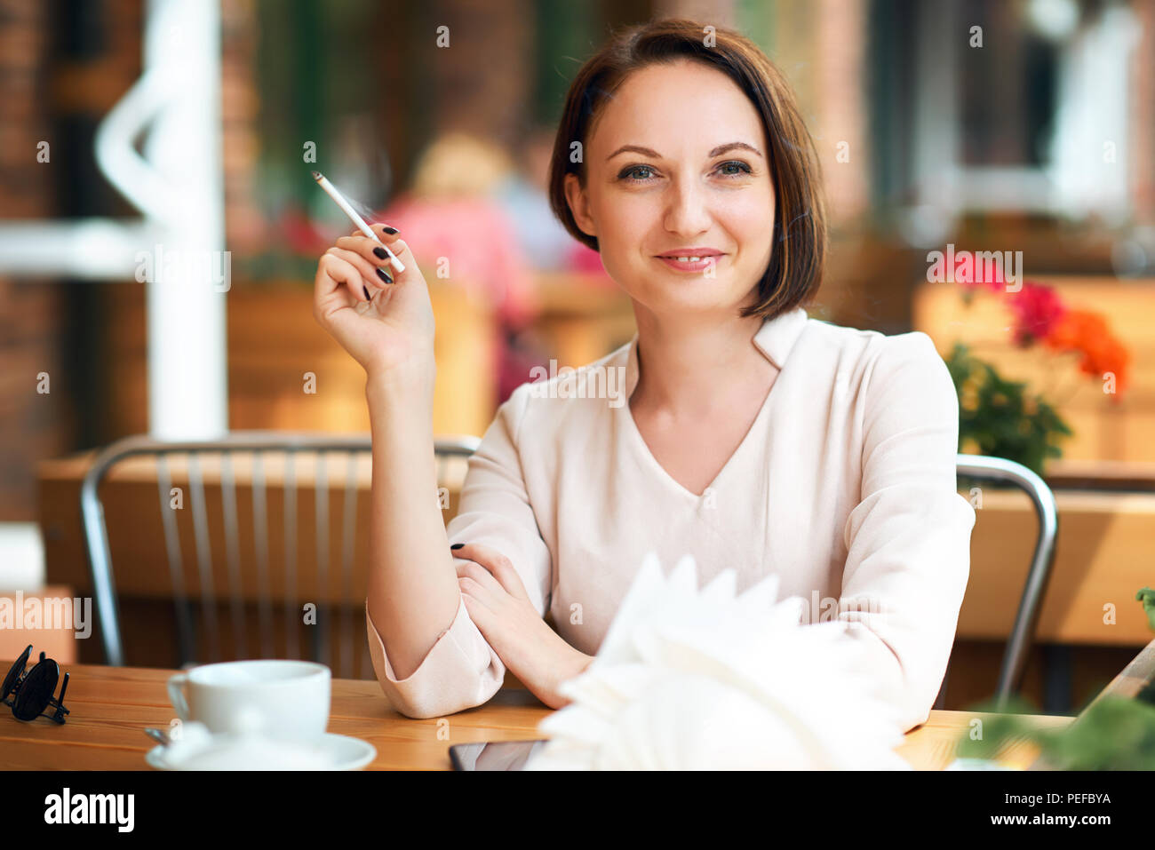 Young woman drinking coffee smoking hires stock photography and images