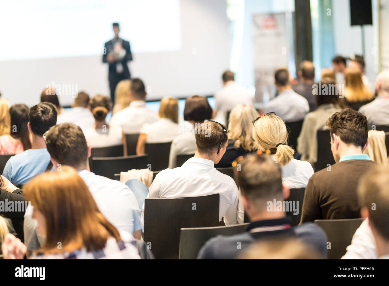 Business speaker giving a talk at business conference event Stock Photo