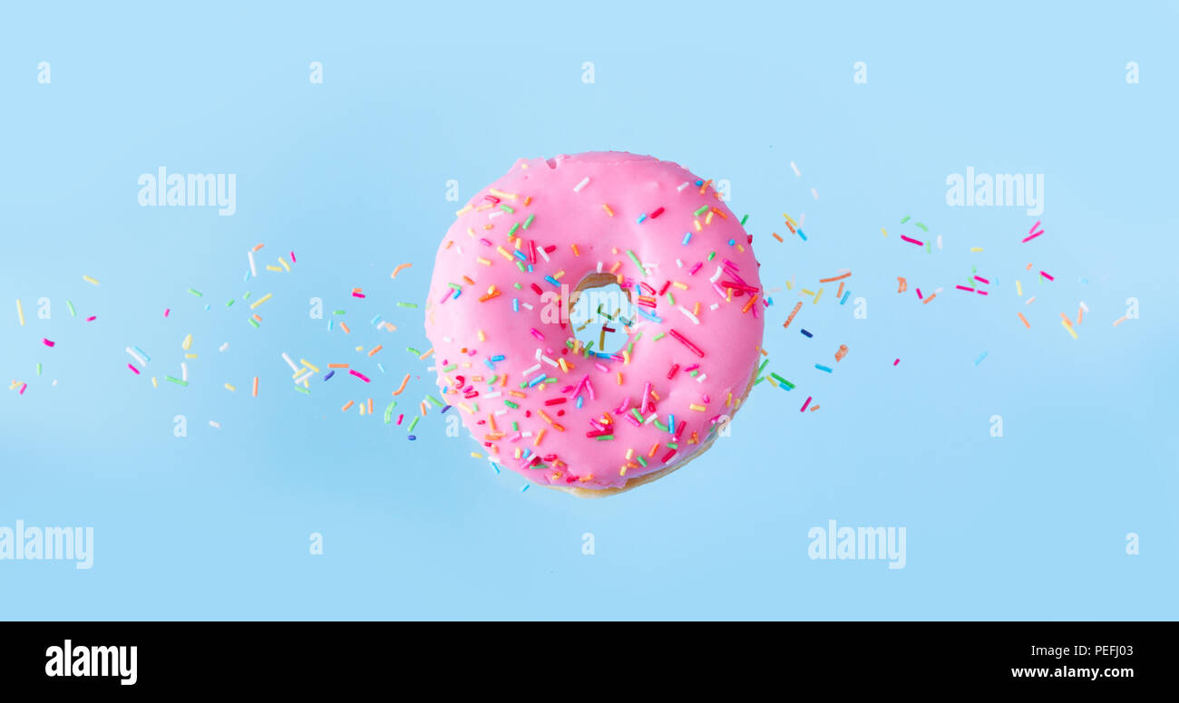 flying doughnuts on blue Stock Photo