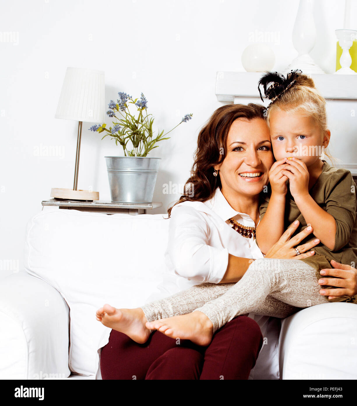 happy smiling mother with little cute daughter at home interior, Stock Photo