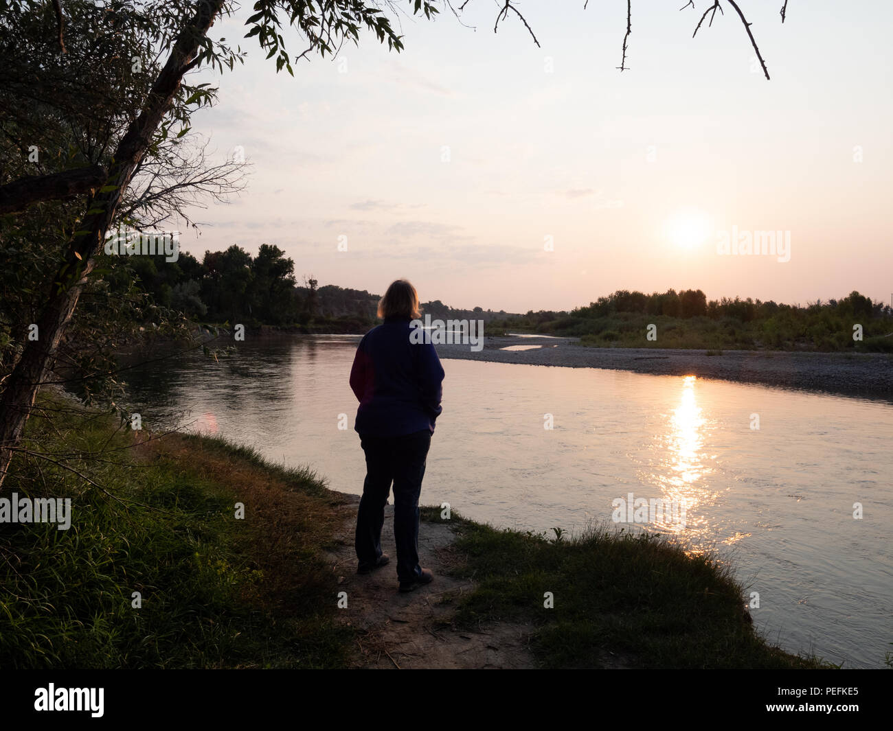 Woman standing by river hi-res stock photography and images - Alamy