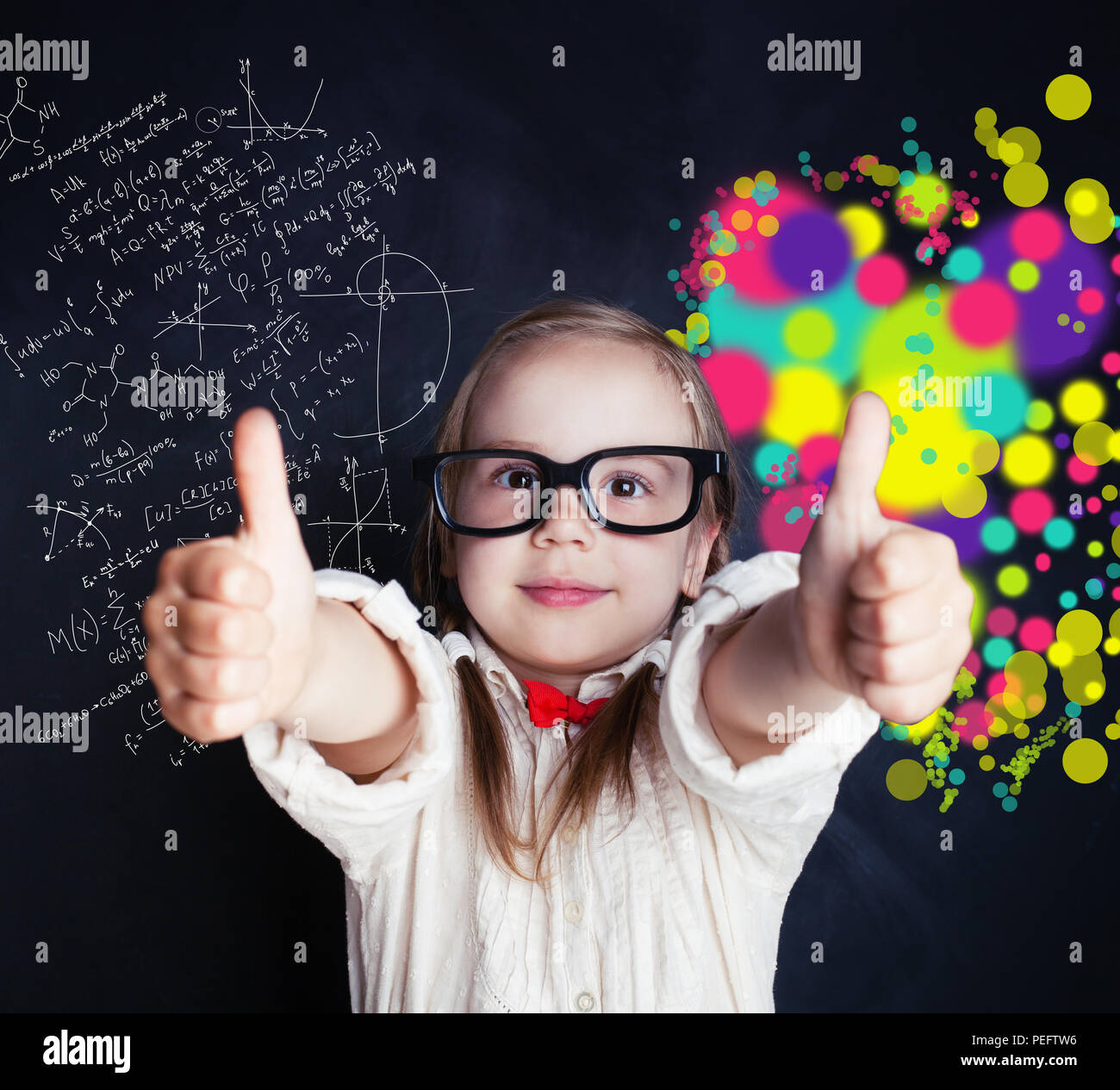 Little genius girl on chalk board in classroom with symbol of right and