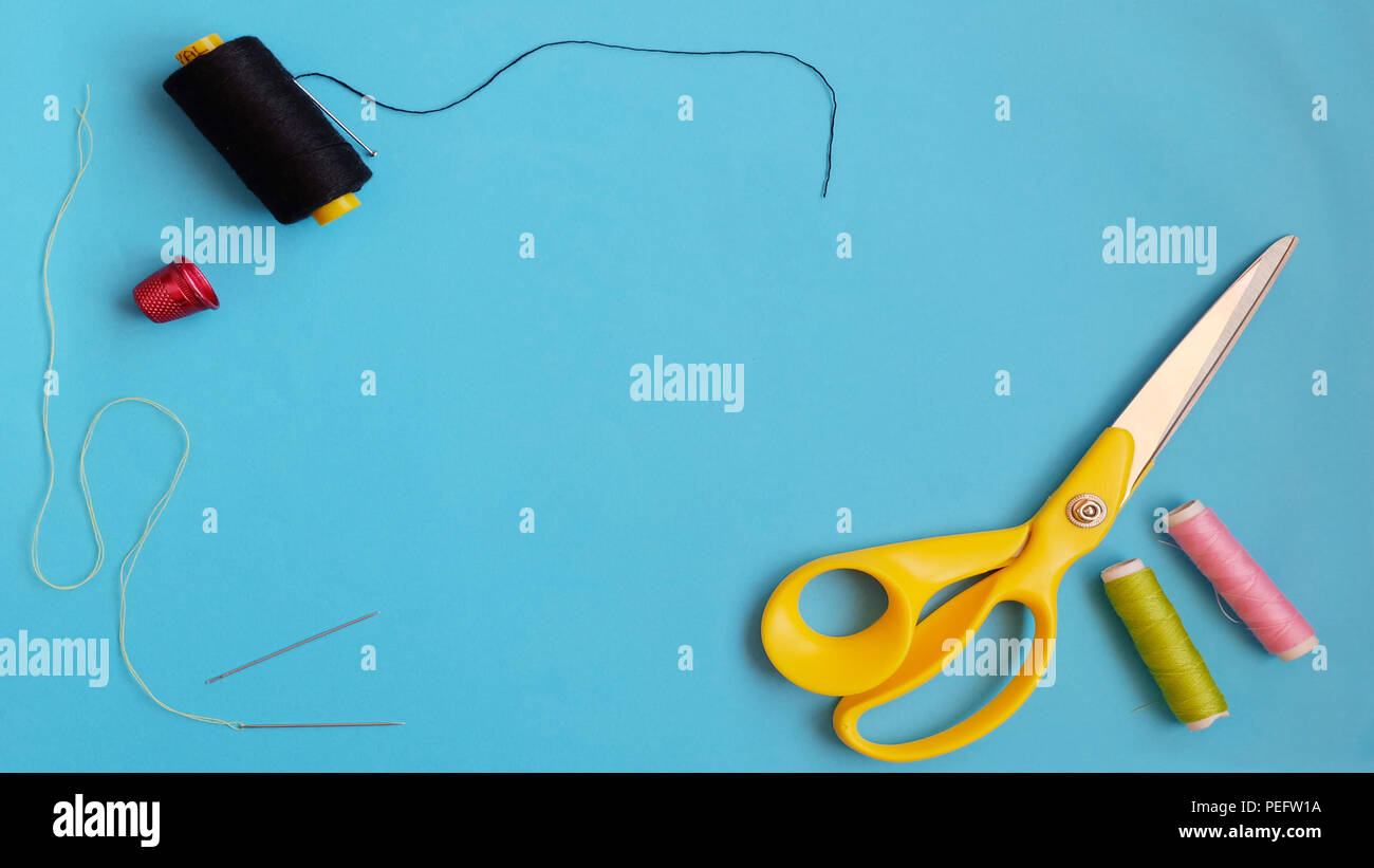 Sewing kits of scissors, needles, thread rolls and thimble Stock Photo