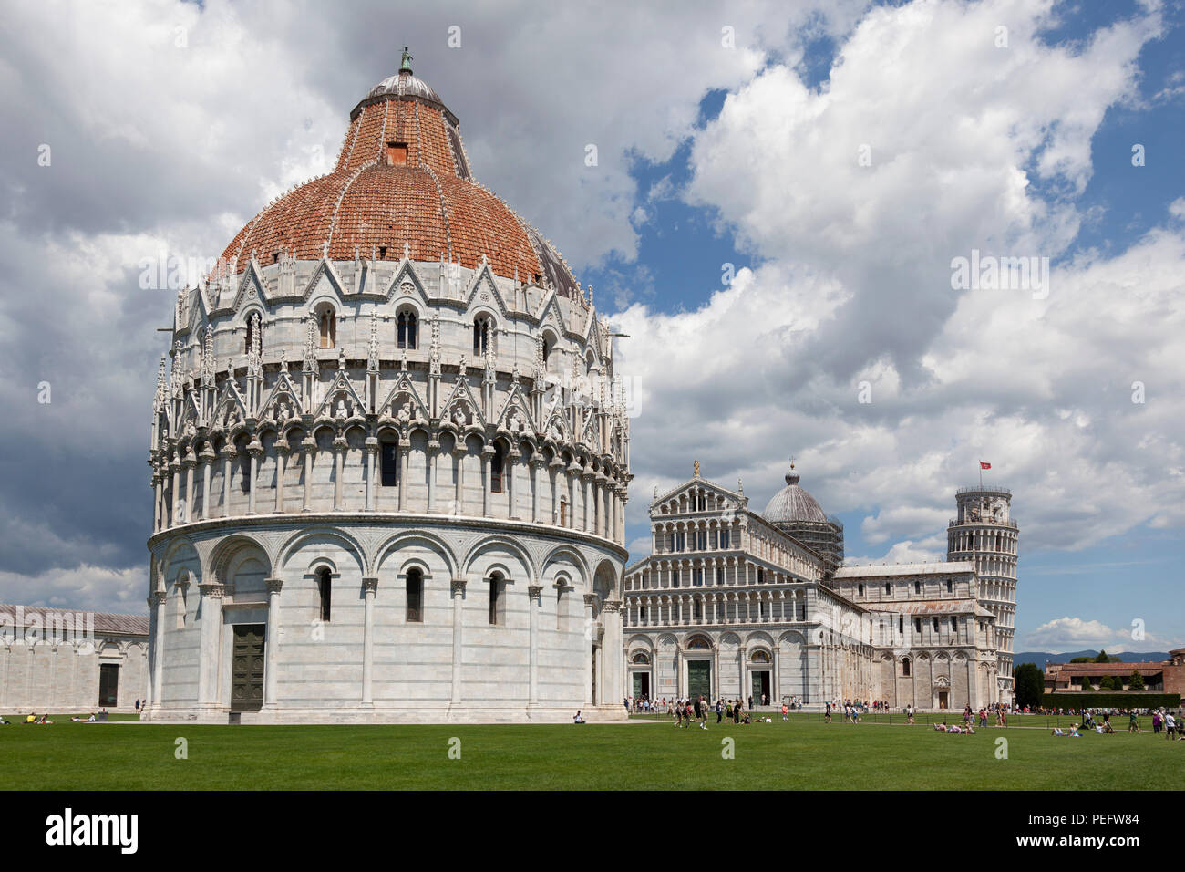 On the 'Field of Miracles' at Pisa (Tuscany - Italy), the Baptistry (under renovation at the time of the shot), the cathedral and the campanile. Stock Photo
