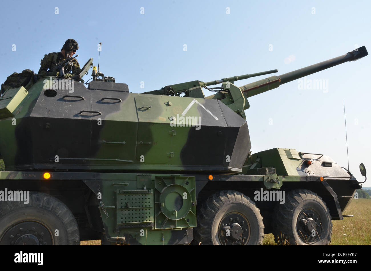 Czech soldiers of Alpha Battery, 132nd Artillery Battalion, 13th Artillery Brigade, conduct simulated fire training in a DANA 152 MM self-propelled Howitzer during exercise Allied Spirit II at the U.S. Army’s Joint Multinational Readiness Center in Hohenfels, Germany, Aug. 12, 2015. Allied Spirit II is a multinational decisive action training environment exercise that involves over 3,500 Soldiers from both the U.S., allied, and partner nations focused on building partnerships and interoperability between all participating nations and emphasizing mission command, intelligence, sustainment, and Stock Photo