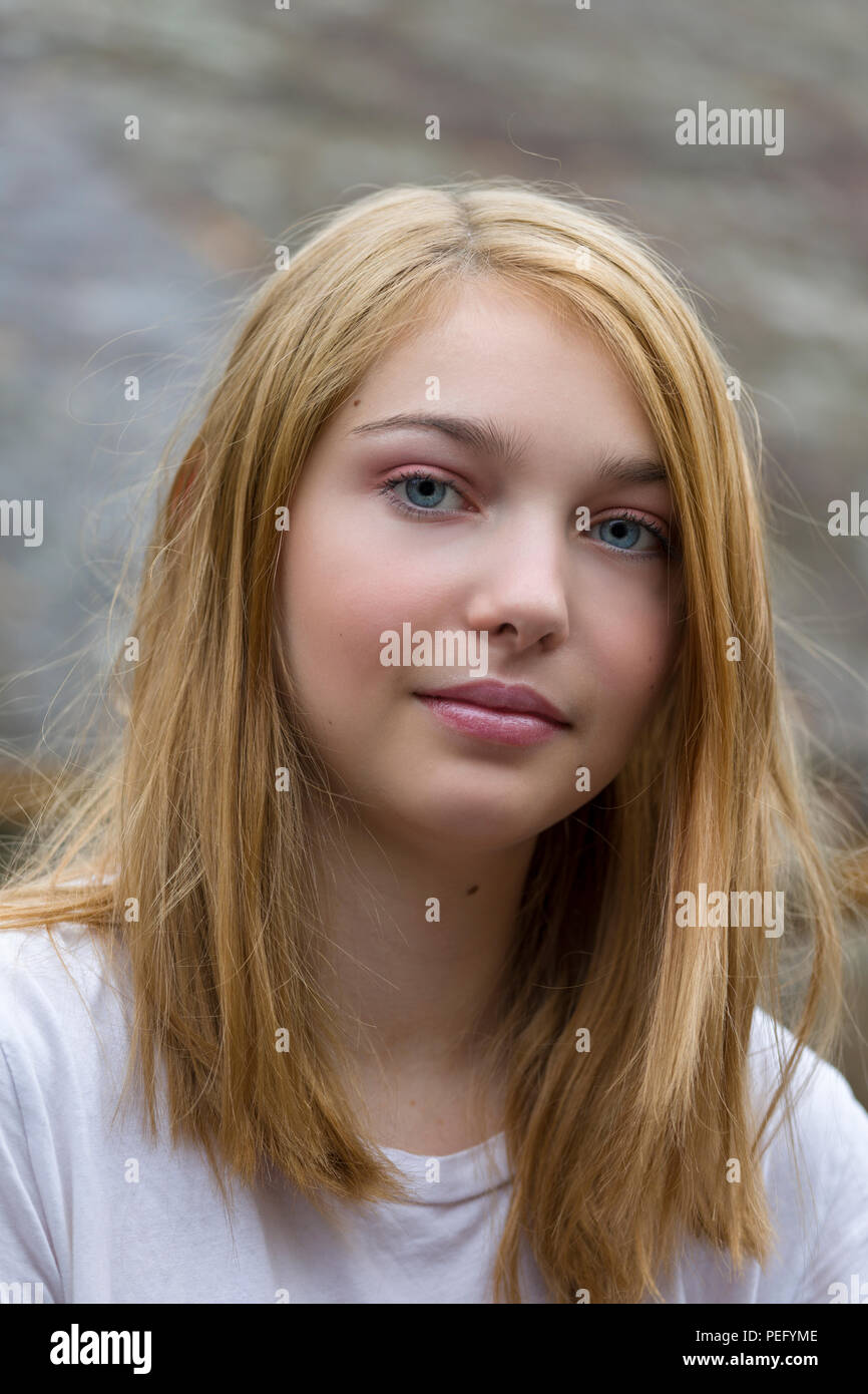 Close up candid portrait of beautiful and pretty 15 year old teenage female caucasian girl Stock Photo