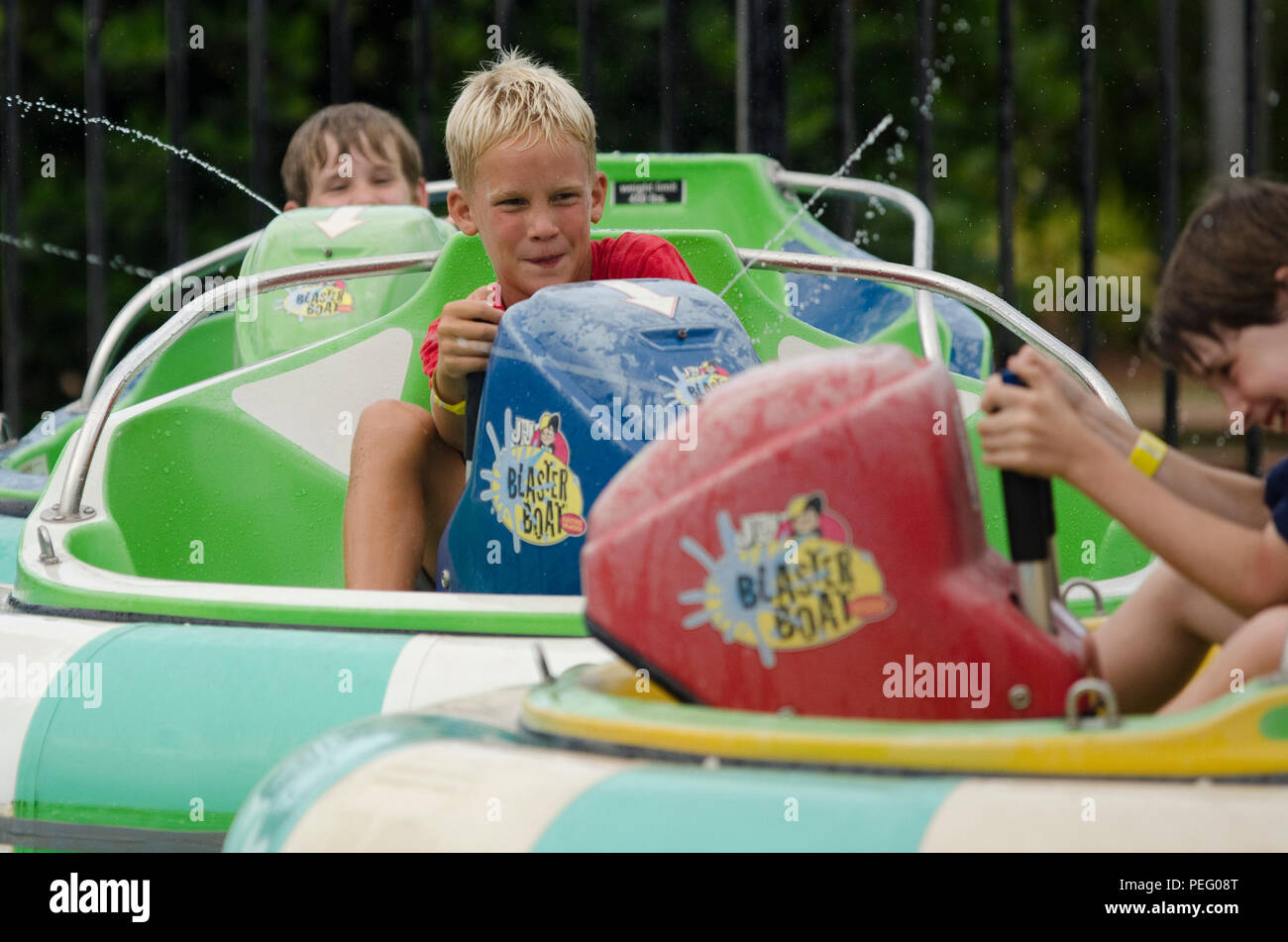Zach Maita rides the bumper boats with his friends at Tiki Island near