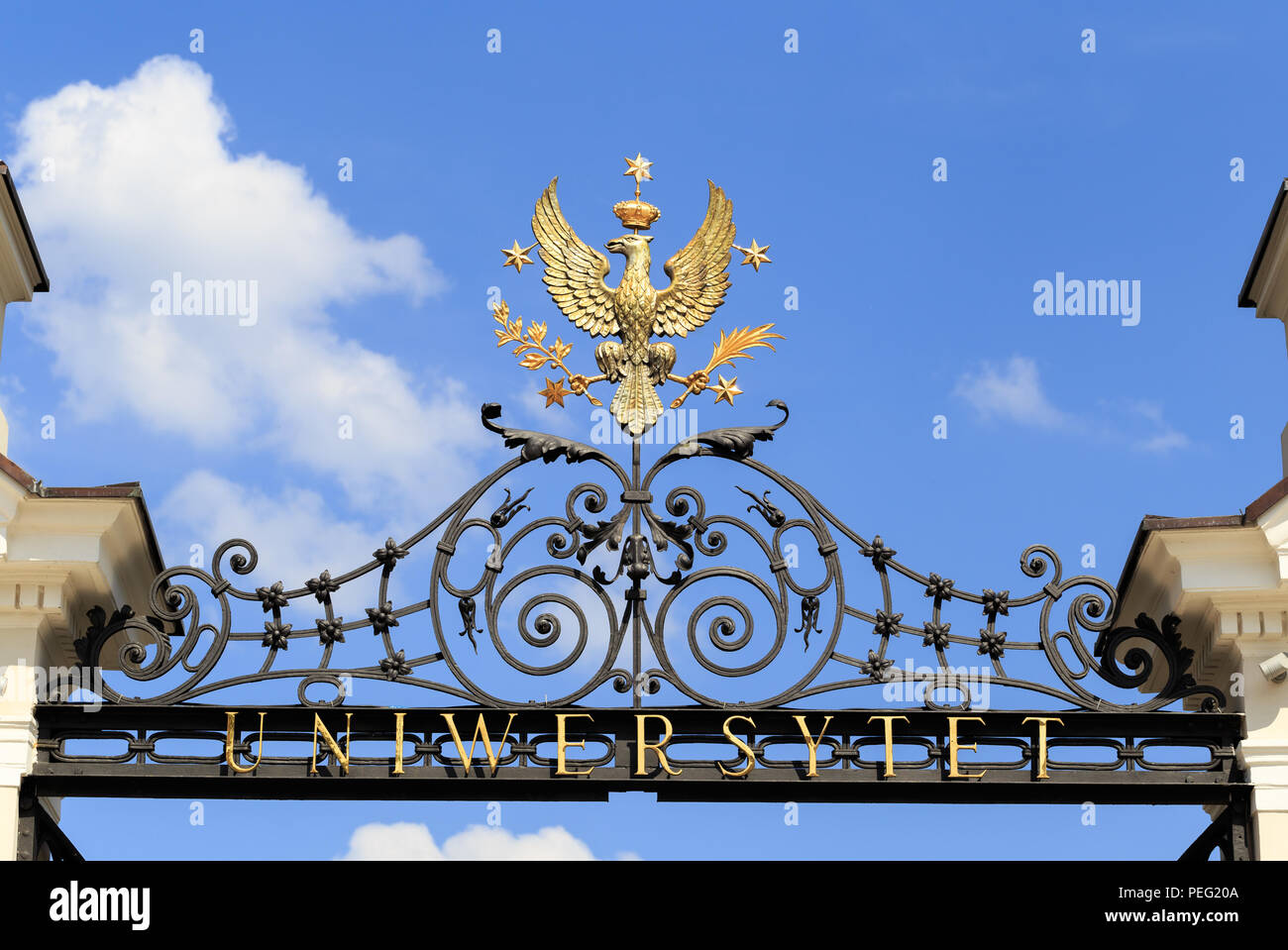 The Eagle with Crown - The symbol of University of Warsaw located above the main gate to courtyard in front of  Collegium Novum building Stock Photo