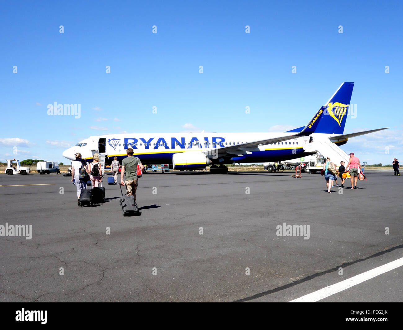 Travellers leaving plane hi-res stock photography and images - Alamy