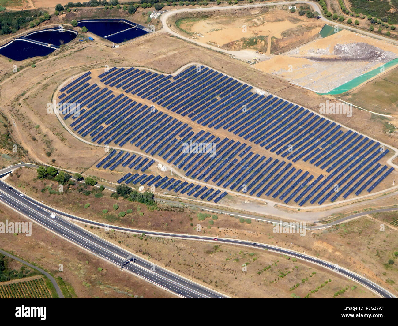 Solar Farm near to Chemin Rural 61 34500 Béziers France  and the road known as the A75 - E11 Stock Photo