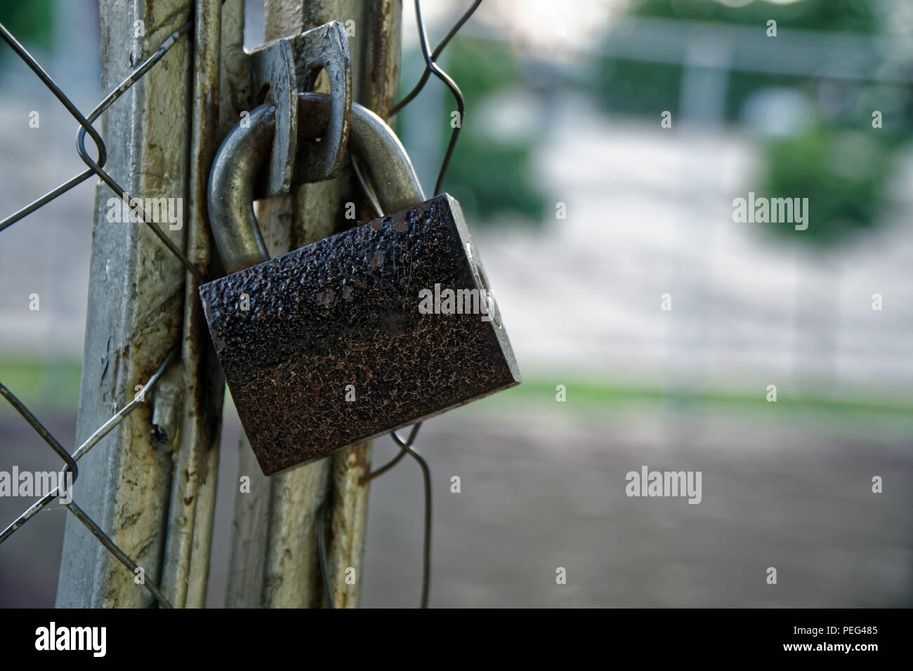 Steel rusted Closed Padlock on aluminium mesh Stock Photo Alamy