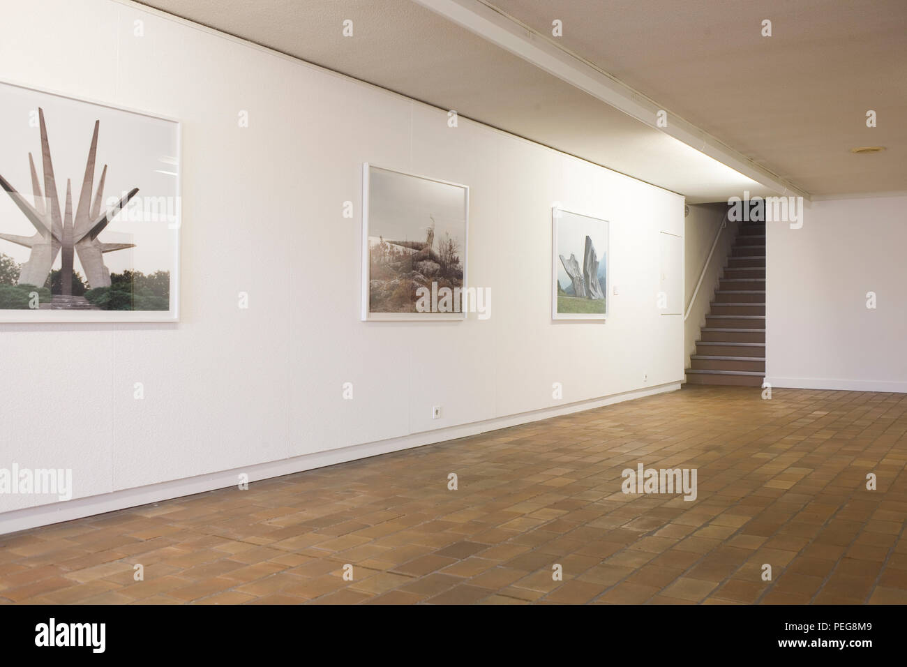 First floor exhibition room with photographs of rural sculptures in Mu.ZEE Stock Photo