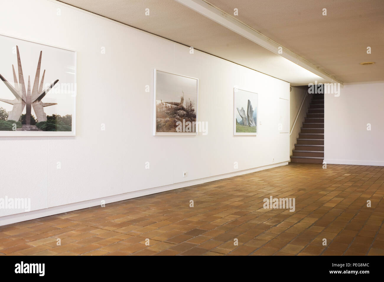 First floor exhibition room with photographs of rural sculptures in Mu.ZEE Stock Photo