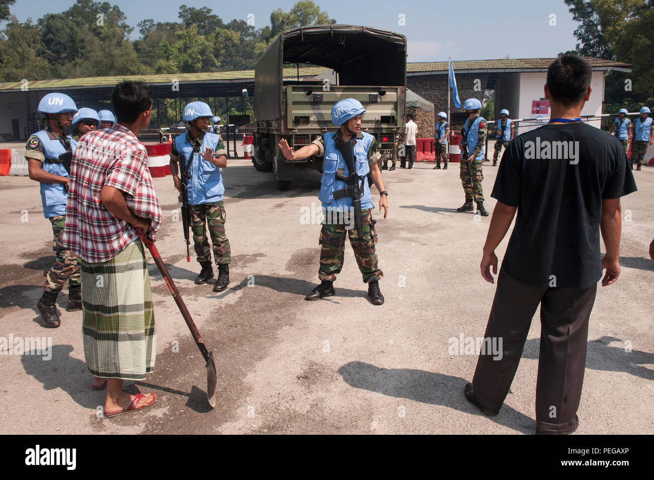 Members Of The Malaysian Armed Forces Control Traffic At A Distribution Site Prior To A Vehicle Search During Exercise Keris Aman 2015 At Segenting Camp Aug 13 In Port Dickson Malaysia Members