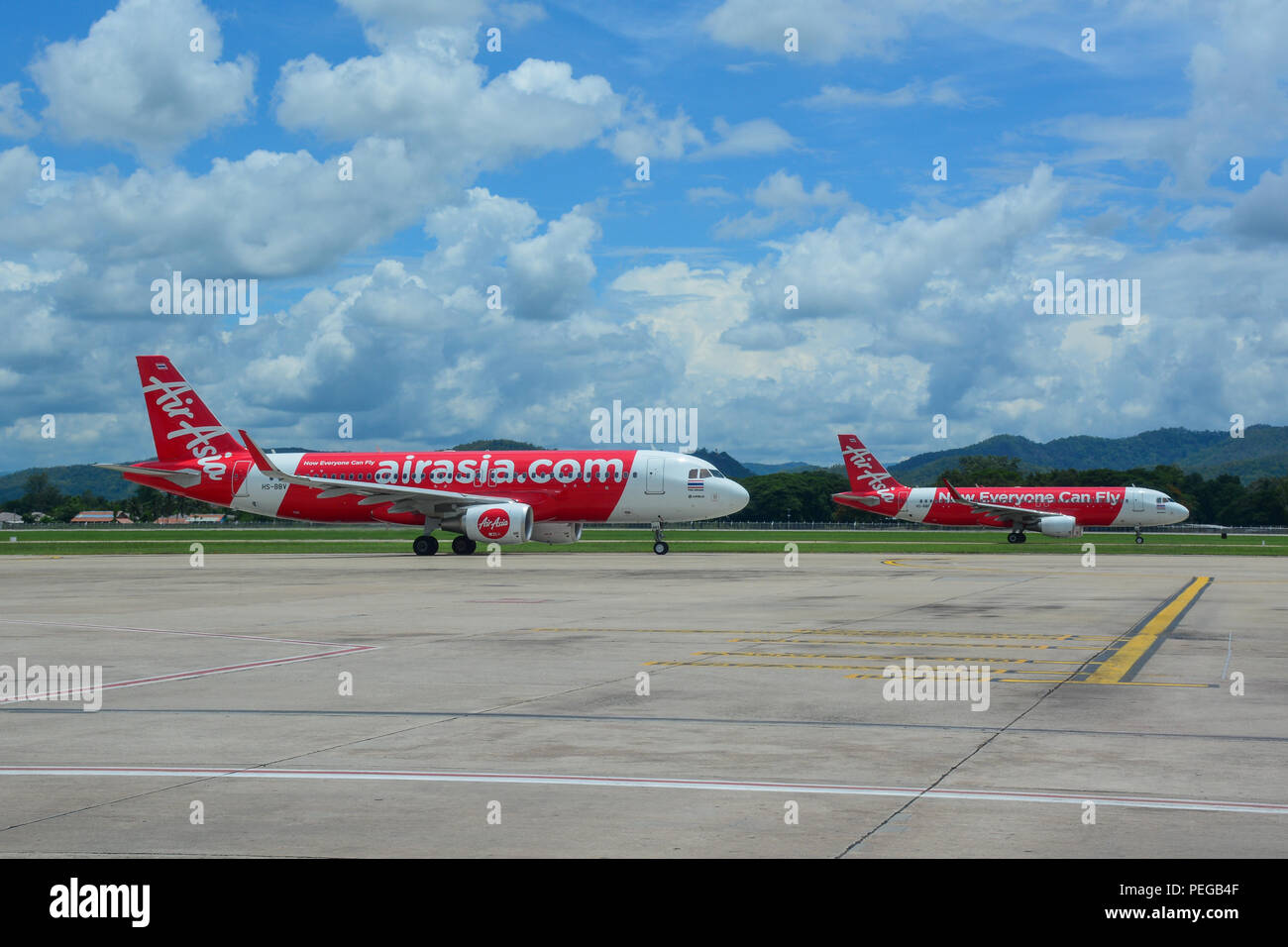 Chiang Mai, Thailand - Jun 22, 2016. Airbus A320 airplanes of AirAsia taxiing on runway of Chiang Mai Airport (CNX). Stock Photo