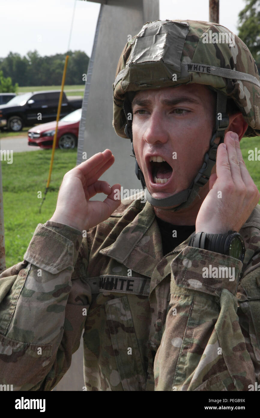 U.S. Army Capt. Jeremy White, Alpha Company, 1st Battalion, 507th Parachute Infantry Regiment, gives the check static line command during Sustained Airborne Training in preparation for the 75th Anniversary Airborne School jump at William T. drop zone in Ft. Benning, Ga., Aug. 14, 2015. The 1-507th Parachute Infantry Regiment(PIR) Battalion celebrates 75 years of the U.S. Army Airborne School and the commemoration of the last qualifying jump of the first airborne test platoon on Aug. 15, 1940. (U.S. Army Photo by Spc. Joshua Talley/ Released) Stock Photo