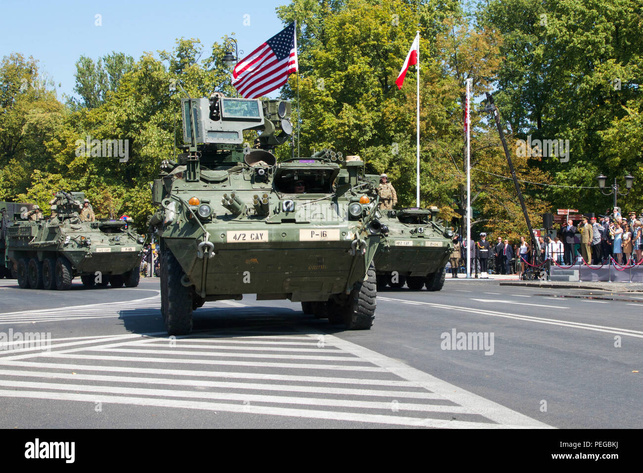 Soldiers with P Troop, 4th Squadron, 2nd Cavalry Regiment operate Stryker vehicles during a parade Aug. 15, 2015, in Warsaw, Poland. Armed Forces Day is a national holiday commemorating the 1920 victory over Soviet Russia at the Battle of Warsaw during the Polish-Soviet War. The training is part of Operation Atlantic Resolve, an ongoing multinational partnership focused on joint training and security cooperation between NATO allies. Led by the mission command element of the 4th Infantry Division and in conjunction with European partner nations, Atlantic Resolve is intended to improve combined  Stock Photo