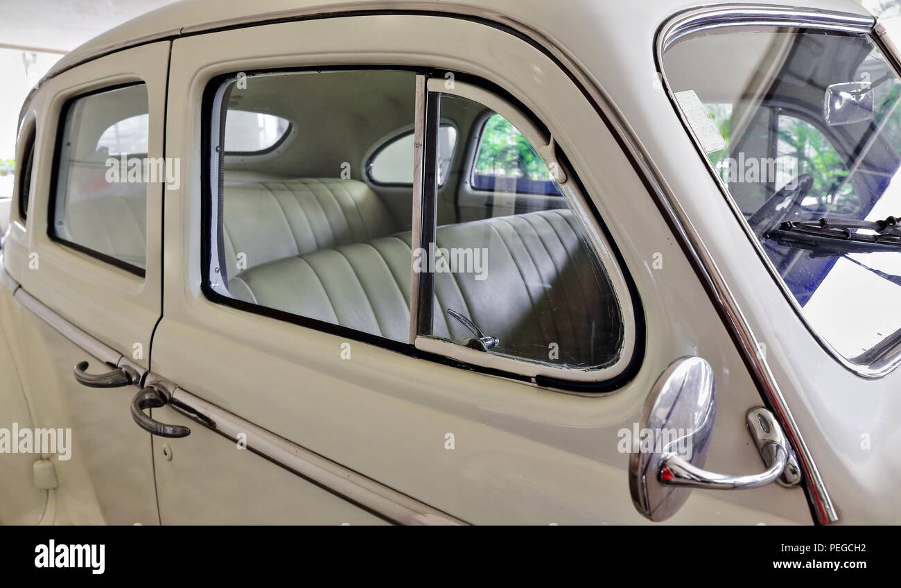 Right Side View Of Ivory Painted Body Of Vintage Car Of The 1940s