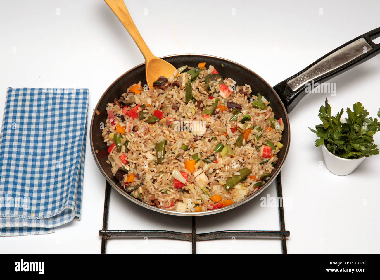 Wholemeal rice with surimi and vegetables. Step by step. Prepared dish