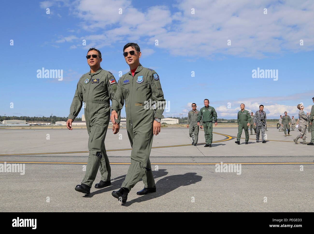Philippine Air Force Maj. Gen. Galileo Gerard Rio Kintanar, Jr., left, and Republic of Korea Air Force Maj. Gen. Chang Hoi Hur, converse while touring the flight line during the Red Flag-Alaska Executive Observer Program on Joint Base Elmendorf-Richardson, Alaska, Aug. 14, 2015. Senior air leaders, from Australia, Bangladesh, Germany, Indonesia, Japan, the Republic of Korea, Malaysia, Mongolia, NATO, New Zealand, the Philippines, Thailand, the United Kingdom, and the U.S., were on JBER to observe in Red Flag-Alaska, a series of Pacific Air Forces commander-directed training exercises for U.S.  Stock Photo