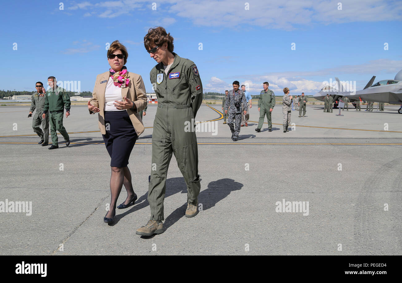 Heidi Grant, left, the deputy under secretary of the Air Force, International Affairs, and Brig. Gen. Dawn Dunlap, commander of NATO Airborne Early Warning and Control Force Command, converse while touring the flight line during the Red Flag-Alaska Executive Observer Program on Joint Base Elmendorf-Richardson, Alaska, Aug. 14, 2015. Senior air leaders, from Australia, Bangladesh, Germany, Indonesia, Japan, the Republic of Korea, Malaysia, Mongolia, NATO, New Zealand, the Philippines, Thailand, the United Kingdom, and the U.S., were on JBER to observe in Red Flag-Alaska, a series of Pacific Air Stock Photo